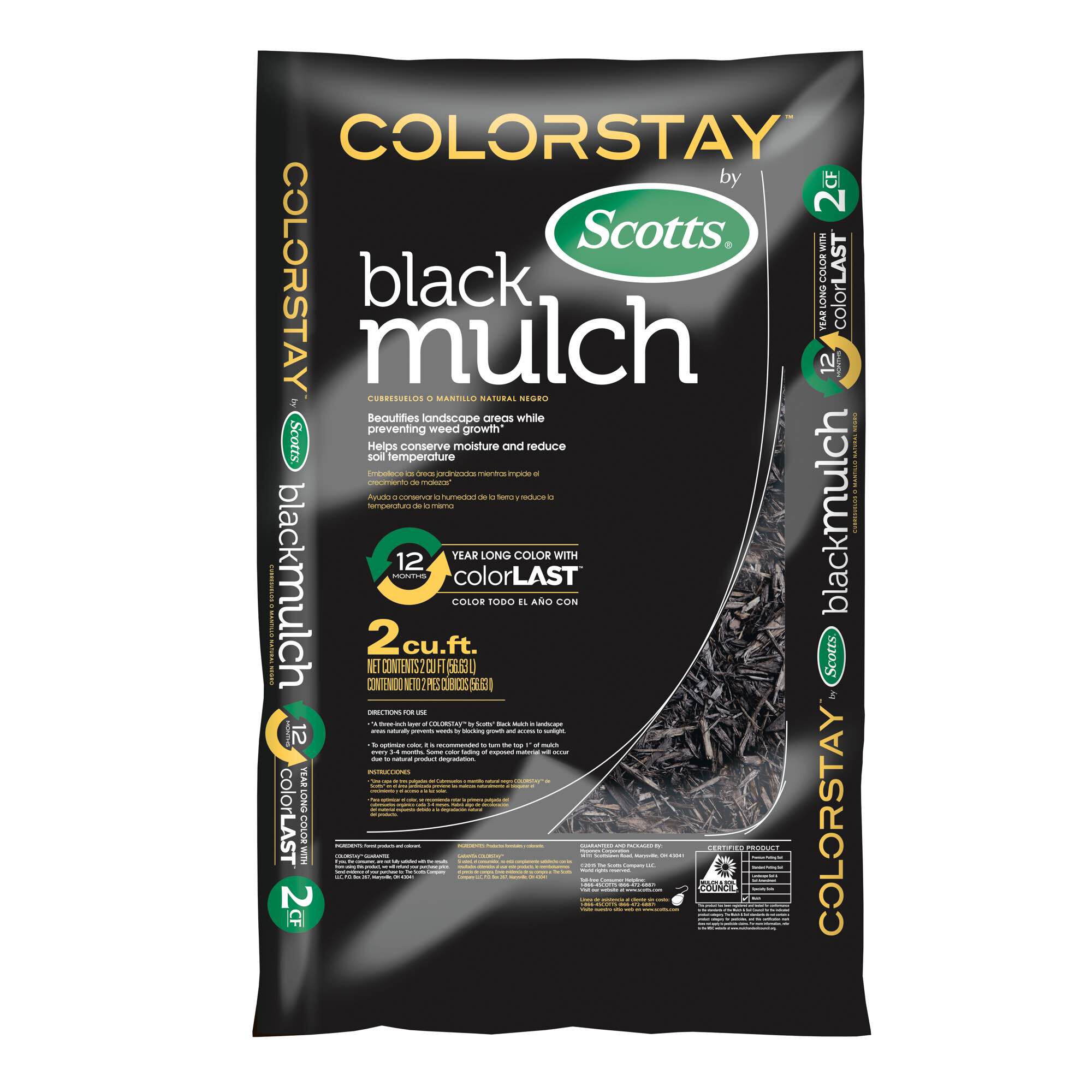 Image of Person spreading Scotts ColorStay mulch in their yard